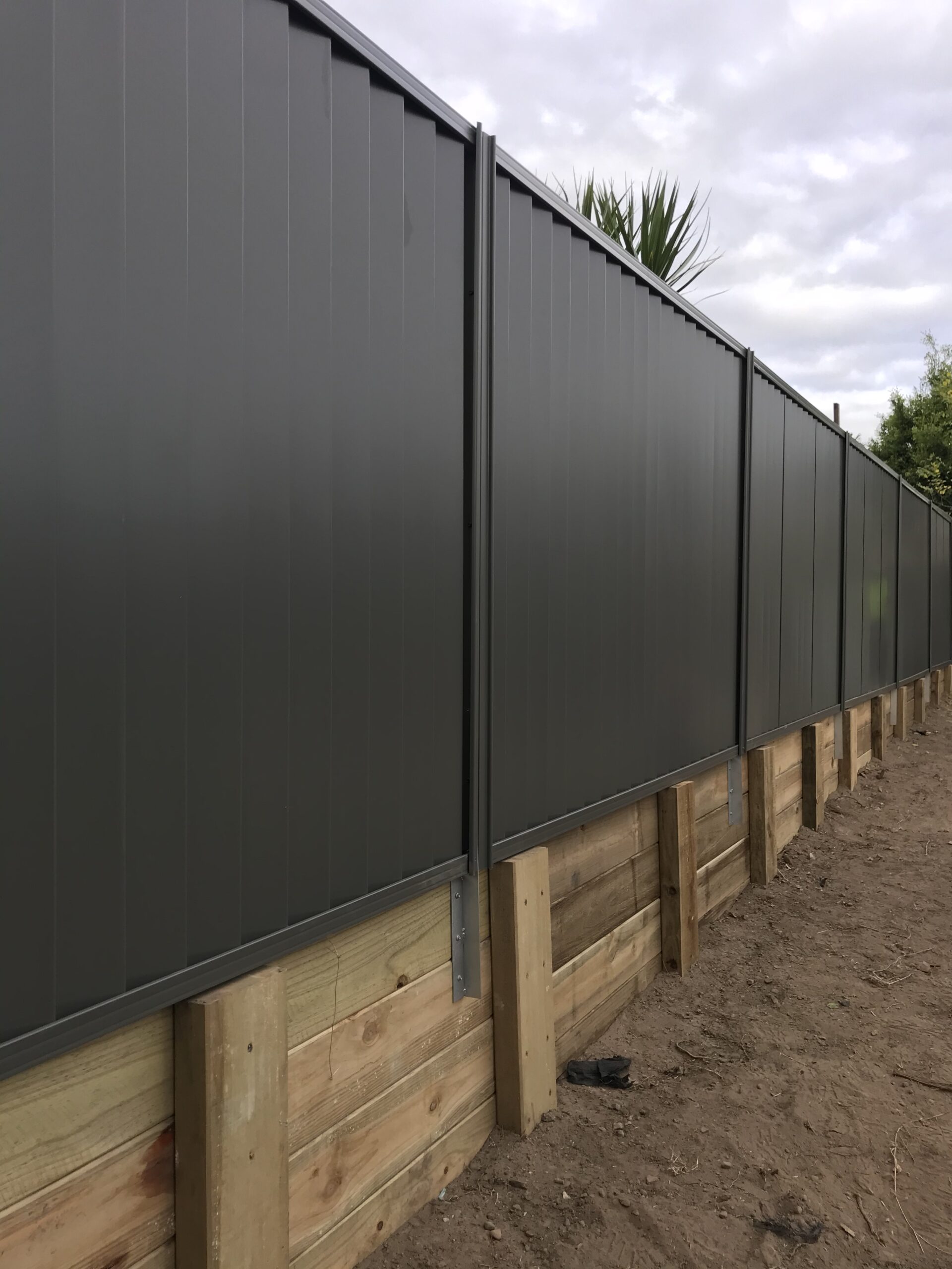 Rycan Maintenance Colorbond Fence and Timber Retaining Wall Installation Brisbane